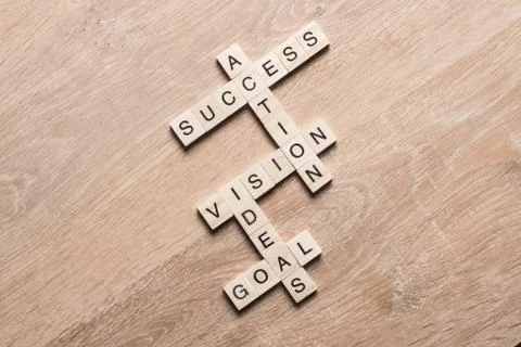 Conceptual business keywords on table with elements of game making crossword Stock Photos