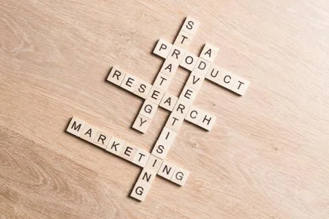 Conceptual business keywords on table with elements of game making crossword Stock Photos