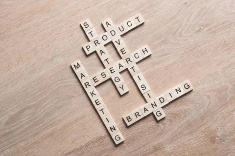 Conceptual business keywords on table with elements of game making crossword 스톡 사진