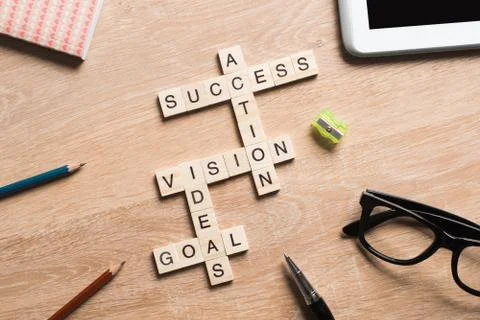 Conceptual business keywords on table with elements of game making crossword Stock Photos