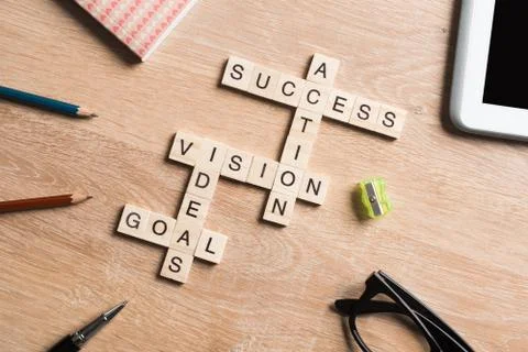 Conceptual business keywords on table with elements of game making crossword Stock Photos