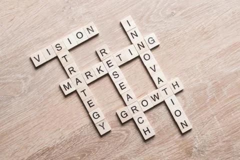 Conceptual business keywords on table with elements of game making crossword Stock Photos