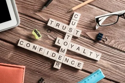 Conceptual business keywords on table with elements of game making crossword Stock Photos