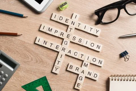 Conceptual business keywords on table with elements of game making crossword Stock Photos