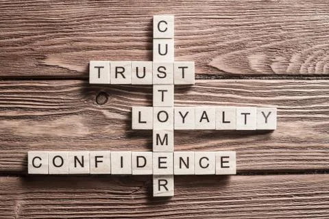 Conceptual business keywords on table with elements of game making crossword 스톡 사진