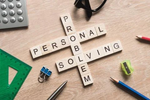 Conceptual business keywords on table with elements of game making crossword Stockfoto's