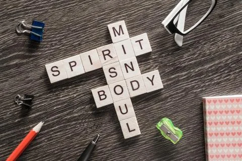 Conceptual business keywords on table with elements of game making crossword 写真素材