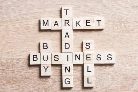 Conceptual business keywords on table with elements of game making crossword Stock Photos