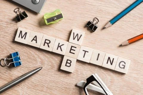 Conceptual business keywords on table with elements of game making crossword Stock Photos