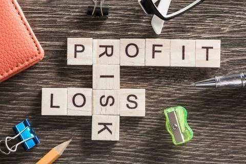 Conceptual business keywords on table with elements of game making crossword Stock Photos