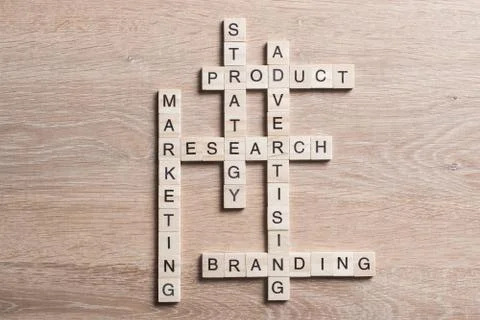 Conceptual business keywords on table with elements of game making crossword 스톡 사진