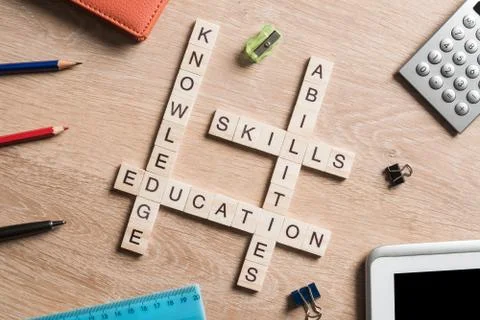 Conceptual business keywords on table with elements of game making crossword Stockfoto's