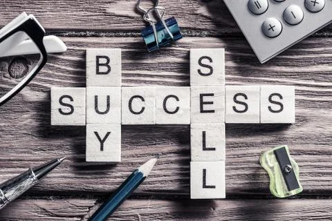 Conceptual business keywords on table with elements of game making crossword Stockfoto's
