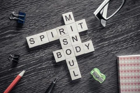 Conceptual business keywords on table with elements of game making crossword Stockfoto's