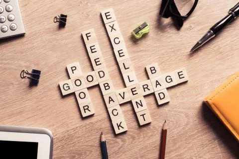 Conceptual business keywords on table with elements of game making crossword Stock Photos