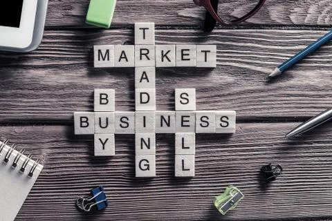 Conceptual business keywords on table with elements of game making crossword Stockfoto's