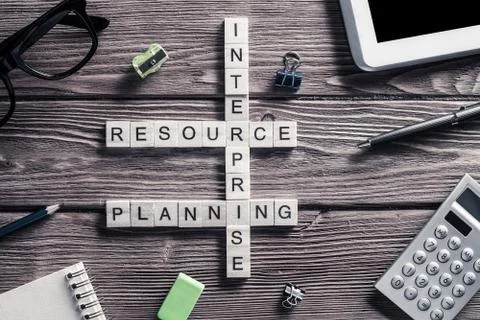 Conceptual business keywords on table with elements of game making crossword Stock Photos