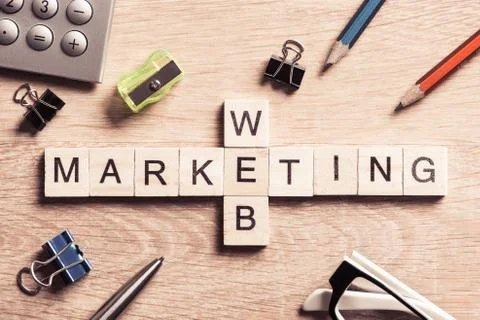 Conceptual business keywords on table with elements of game making crossword Stock Photos
