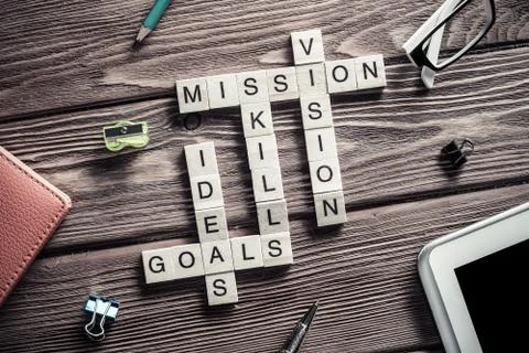 Conceptual business keywords on table with elements of game making crossword Stock Photos