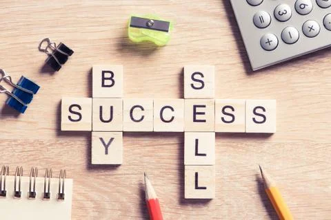 Conceptual business keywords on table with elements of game making crossword Stock Photos