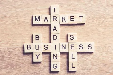 Conceptual business keywords on table with elements of game making crossword Stock Photos