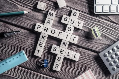 Conceptual business keywords on table with elements of game making crossword Stockfoto's