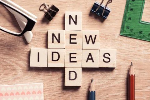 Conceptual business keywords on table with elements of game making crossword Stock Photos