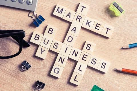 Conceptual business keywords on table with elements of game making crossword Stock Photos
