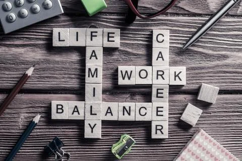 Conceptual business keywords on table with elements of game making crossword Stockfoto's