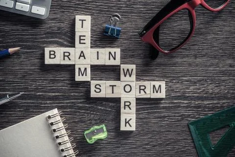 Conceptual business keywords on table with elements of game making crossword Stock Photos