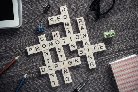 Conceptual business keywords on table with elements of game making crossword 스톡 사진
