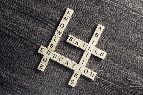 Conceptual business keywords on table with elements of game making crossword Stock Photos