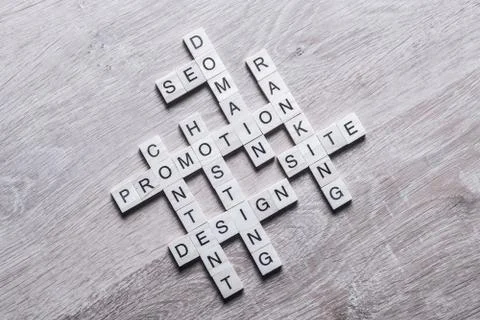 Conceptual business keywords on table with elements of game making crossword Stockfoto's