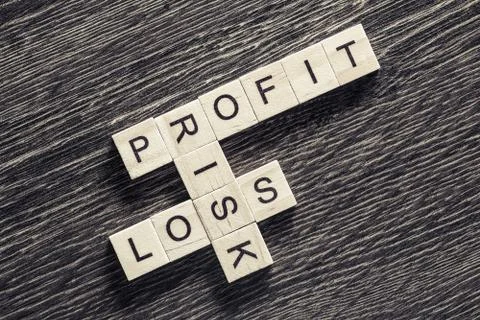 Conceptual business keywords on table with elements of game making crossword 스톡 사진
