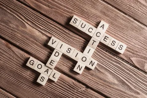 Conceptual business keywords on table with elements of game making crossword Stock Photos