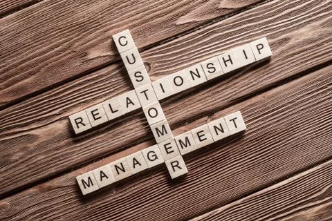 Conceptual business keywords on table with elements of game making crossword Foto stock