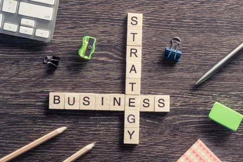 Conceptual business keywords on table with elements of game making crossword Stockfoto's