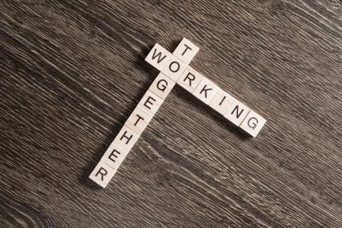 Conceptual business keywords on table with elements of game making crossword Stock Photos