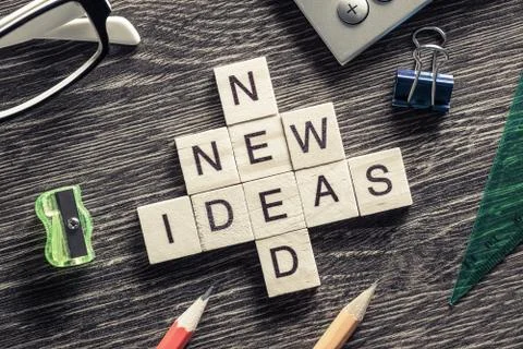 Conceptual business keywords on table with elements making crossword Stock Photos