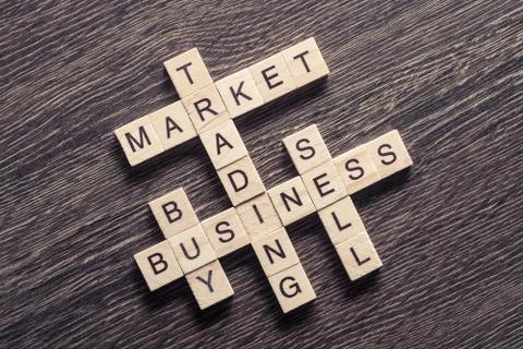 Conceptual business keywords on table with elements making crossword Stock Photos