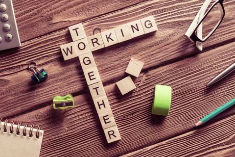 Conceptual business keywords on table with elements of game making crossword Stockfoto's