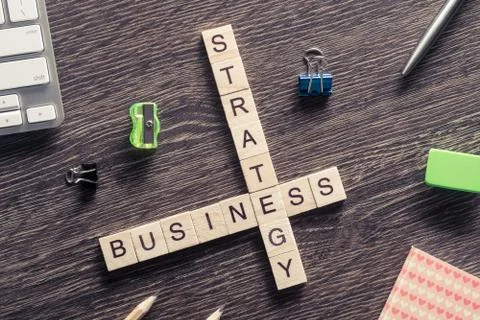 Conceptual business keywords on table with elements of game making crossword Stockfoto's