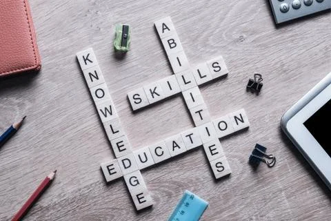 Conceptual business keywords on table with elements of game making crossword Stock Photos