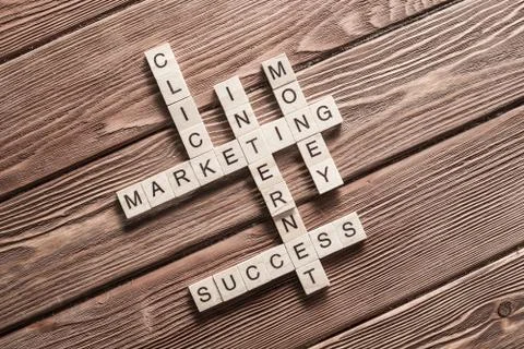 Conceptual business keywords on table with elements of game making crossword Stock Photos