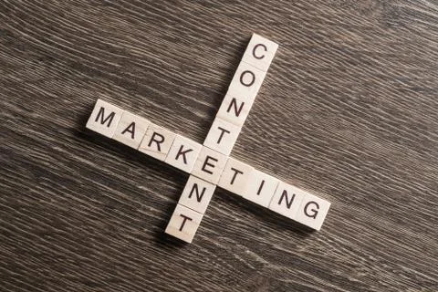 Conceptual business keywords on table with elements of game making crossword Stockfoto's