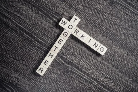 Conceptual business keywords on table with elements of game making crossword Stock Photos