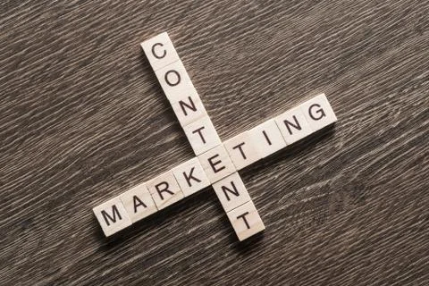 Conceptual business keywords on table with elements of game making crossword Stockfoto's