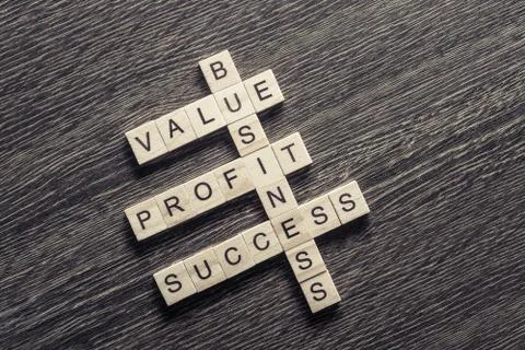 Conceptual business keywords on table with elements of game making crossword Stock Photos