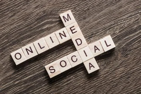 Conceptual business keywords on table with elements of game making crossword Foto stock