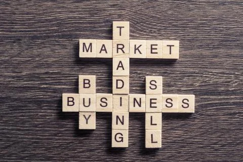 Conceptual business keywords on table with elements of game making crossword Foto stock